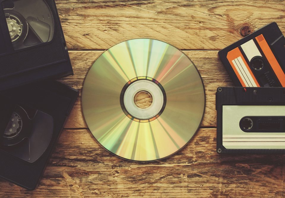 Video tapes, cd disc and audio tapes on a table